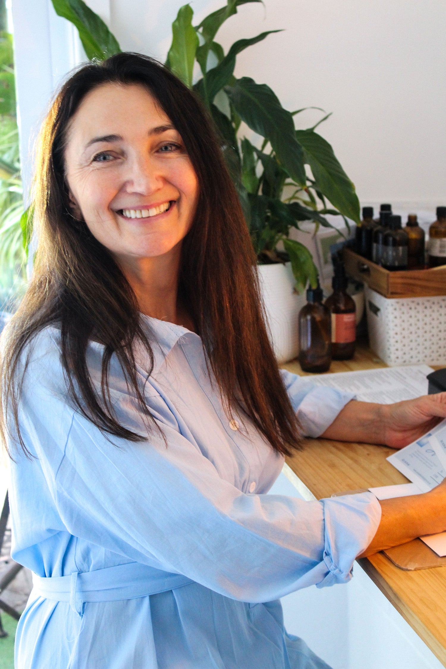 Friendly and experienced practitioner at Oceanbeach Oxygen ready to help you with a consultation on HOCATT sauna, PEMF, and other wellness therapies.