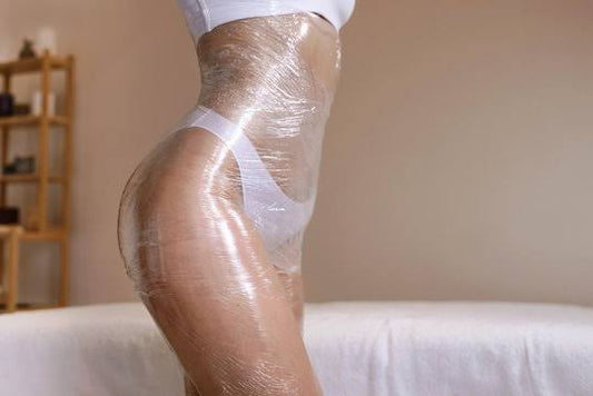 A relaxing photo of a client's leg being wrapped during a fat loss and detoxifying slim wrap session at the Oceanbeach Oxygen clinic.